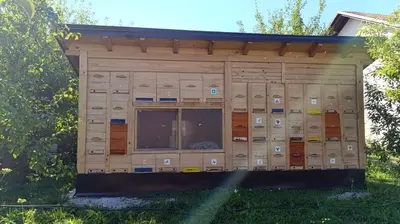 a building with a bunch of lockers in the grass at OZIM oaza zelenila i mira in Podrašnica