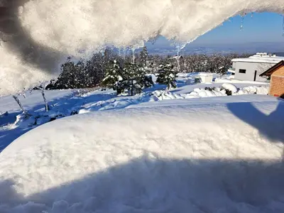 a pile of snow on top of a house at Villa Sunset in Banja Luka