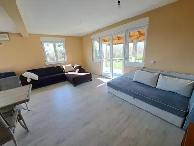 a living room with couches and a couch and a table at Villa Sunset in Banja Luka