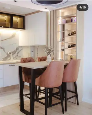 a kitchen with a dining room table and chairs at Lux Apartmani Teslić in Teslić