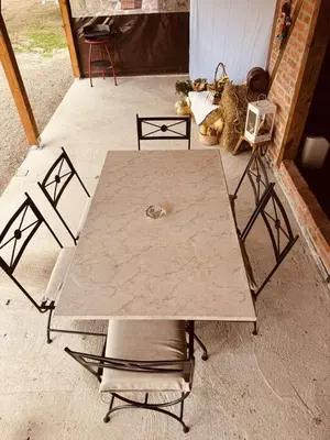 a table and chairs in a room with a table at Lake house in Donji Žabar