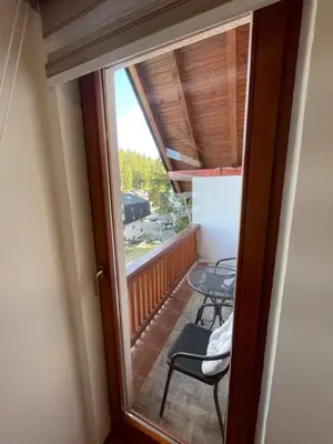 a view of a balcony with a table and chairs at Montis Vlasic Apartment 1 in Vlasic