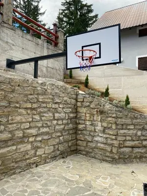 a basketball hoop attached to a stone wall at Montis Vlasic Apartment 1 in Vlasic