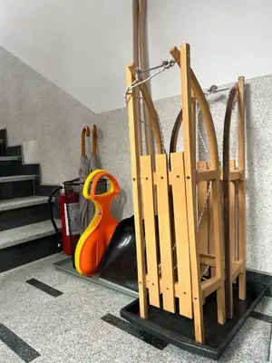 a set of wooden gates in a room with stairs at Montis Vlasic Apartment 2 in Vlasic
