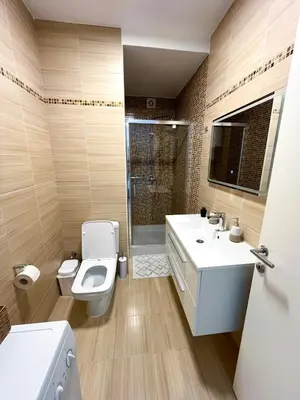 a bathroom with a toilet and a sink and a shower at Apartman Skyroom in Banja Luka