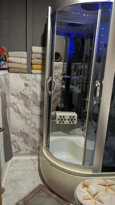 a bathroom with a shower with a sink and a shower at Vila N&M in Grad
