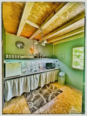 a kitchen with a counter and a sink in a room at Vila N&M in Grad