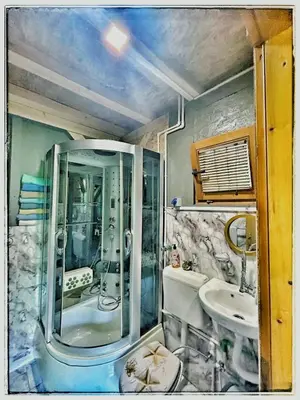 a bathroom with a shower and a sink at Vila N&M in Grad