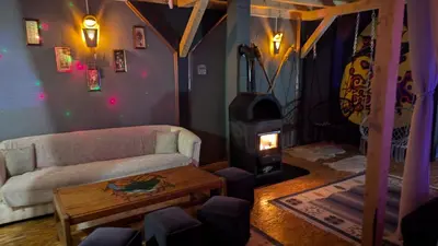 a living room with a couch and a wood stove at Vila N&M in Grad