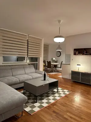 a living room with a couch and a table at Apartman Siesta in Kiseljak