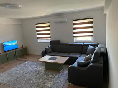 a living room with a couch and a table at Luxury Pyramid Apartment II Visoko in Visoko