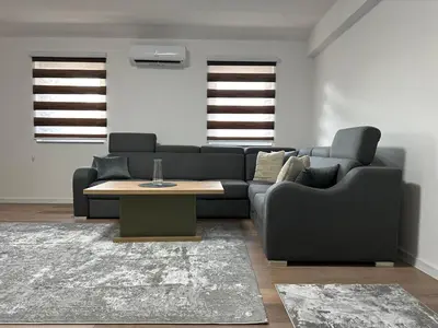 a living room with a couch and a coffee table at Luxury Pyramid Apartment II Visoko in Visoko