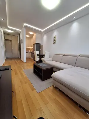 a living room with a couch and a table at DRAGAm in Banja Luka