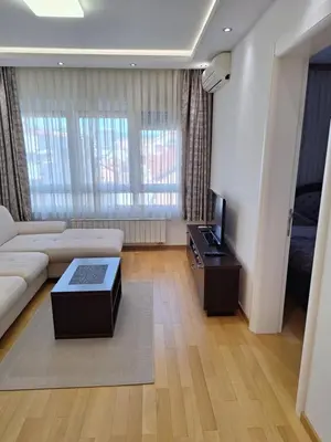 a living room with a couch and a tv at DRAGAm in Banja Luka