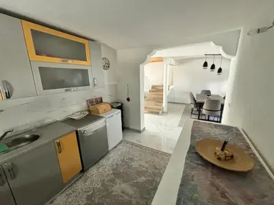 a kitchen with a sink and a counter top at Peace Holiday Home in Bihać