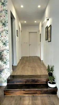 an empty hallway with a potted plant in the middle at Casa Rado in Banja Luka