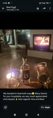 a picture of two glasses on a table with a tv at Casa Rado in Banja Luka