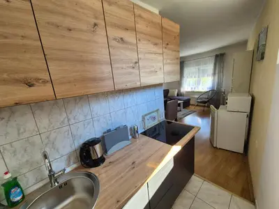 a kitchen with a sink and a counter top at Una in Bosanski Novi