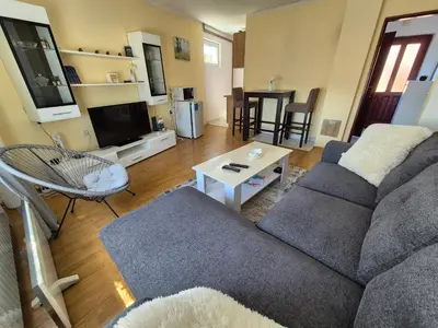 a living room with a couch and a table at Una in Bosanski Novi