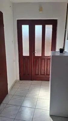 an empty room with a door and a tile floor at Una in Bosanski Novi