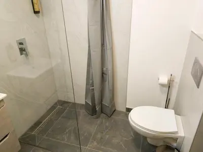 a bathroom with a shower and a toilet at Motel Anić in Novi Travnik