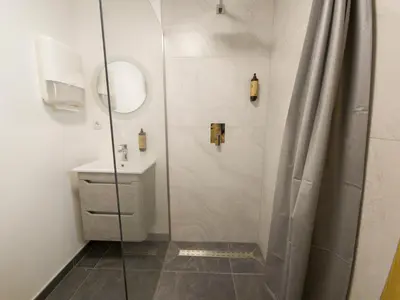a bathroom with a shower and a sink at Motel Anić in Novi Travnik