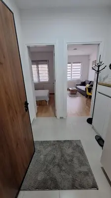 a room with a door leading to a living room at Stan Banjaluka Ada 1 in Rebrovac