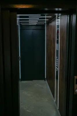 an elevator corridor with a door in a building at Apartmani Galerija in Banja Luka