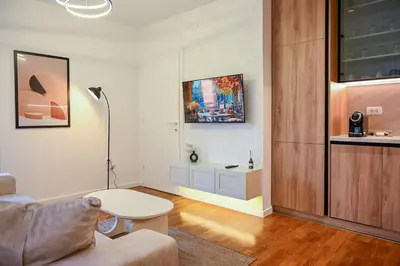 a living room with a couch and a table at Apartmani Galerija in Banja Luka