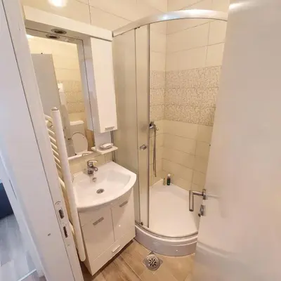 a bathroom with a shower and a sink at Stan na dan centar Jevrejska Banja Luka in Banja Luka
