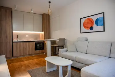 a living room with a couch and a table at Apartman Galerija 1 in Banja Luka