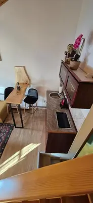 a living room with a tv and a table at Apartmani Viktory in Šišava