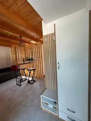 a living room with a table and a table at Villa Paradise in Banja Luka