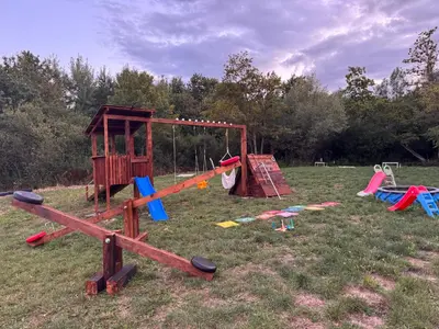 a group of playground equipment in a field at Ranc 1001 noc in Mutnik