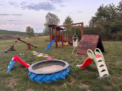 a bunch of playground equipment in a field at Ranc 1001 noc in Mutnik
