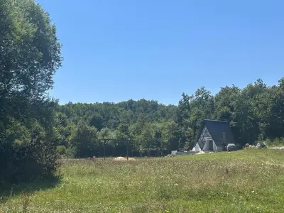 a barn in the middle of a field at Ranc 1001 noc in Mutnik