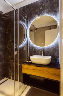 a bathroom with a sink and a mirror at Hotel Marina Home in Prijedor