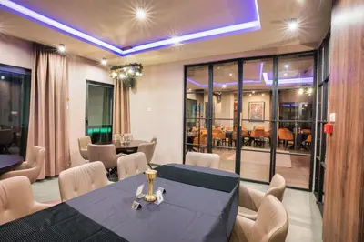 a dining room with a table and chairs at Hotel Marina Home in Prijedor