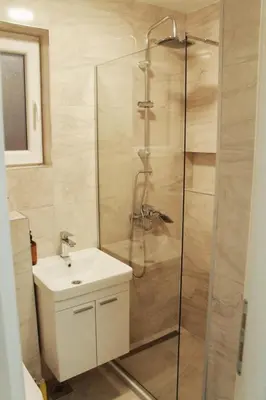 a bathroom with a shower and a sink at EFESA Apartments in Visoko
