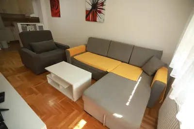 a living room with a couch and a chair at Apartment - Princ in Banja Luka