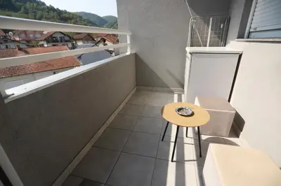 a small room with a table and a balcony at Apartment - Princ in Banja Luka