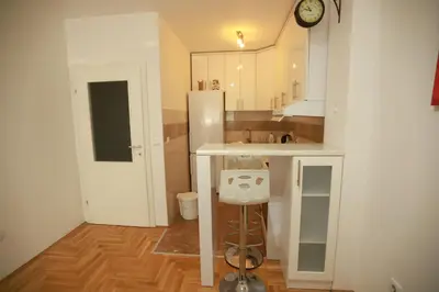 a small kitchen with a counter and a sink at Apartment - Princ in Banja Luka