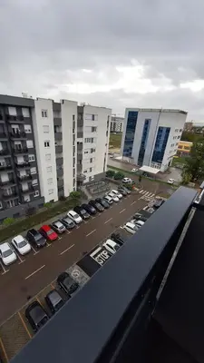 a view of a parking lot with parked cars at Stan na dan Banjaluka Ada 3 in Rebrovac