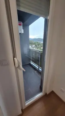 an open door with a view of a balcony at Stan na dan Banjaluka Ada 3 in Rebrovac