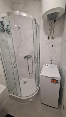 a bathroom with a shower with a toilet and a sink at Stan na dan Banjaluka Ada 3 in Rebrovac