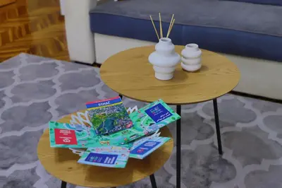 a coffee table with snacks and vases on it at Apartman Toromanovic in Bihać