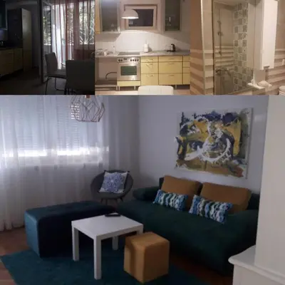 a living room with a couch and a kitchen at Apartman iza Boske in Banja Luka