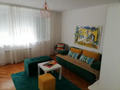 a living room with a couch and a table at Apartman iza Boske in Banja Luka