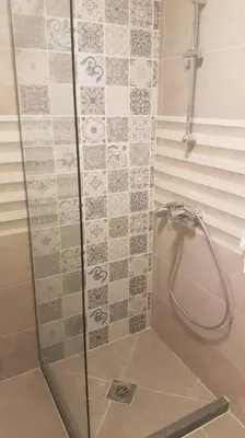 a shower with a glass door in a bathroom at Apartman iza Boske in Banja Luka