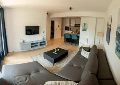 a living room with a couch and a table at LuxDS in Tuzla